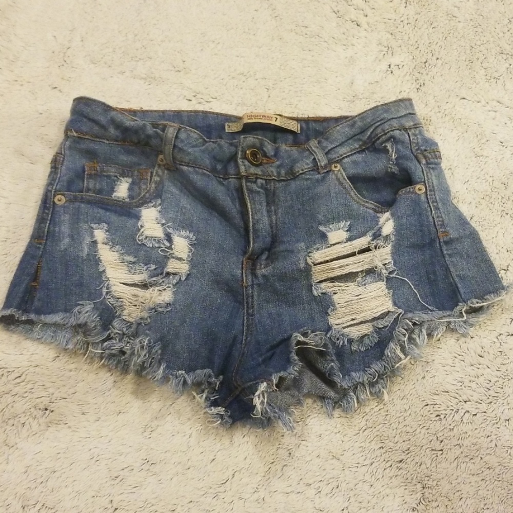 Cutoff distressed blue jean shorts